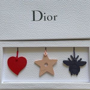 Christian Dior set of three bag charms, new in box